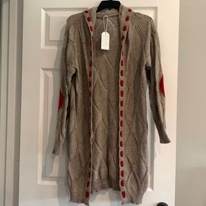 Knitted sweater.  Knee length. Size small.  Beige with rust colored patches.